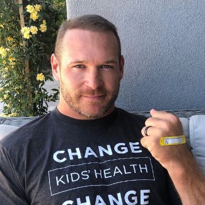 Brian Urlacher is wearing a black shirt that says Change Kid's Health.